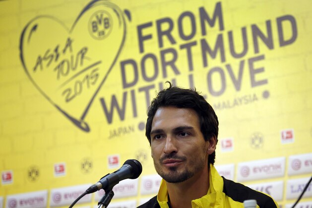 German soccer club Borussia Dortmund's Mats Hummels speaks to the media, Wednesday, July 8, 2015, in Singapore. The team is in the city-state as part of their Asian tour. (AP Photo/Wong Maye-E)