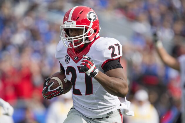 Georgia running back Nick Chubb runs for a touchdown during the first half of an NCAA college football game against Kentucky at Commonwealth Stadium in Lexington, Ky., Saturday, Nov. 8, 2014. Georgia beat Kentucky 63-31. (AP Photo/David Stephenson)