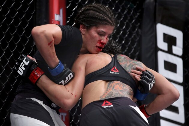 RIO DE JANEIRO, BRAZIL - AUGUST 01:  Claudia Gadelha of Brazil (red) fights Jessica Aguilar of the United States (blue) in their strawweight bout during the UFC 190 Rousey v Correia at HSBC Arena on August 1, 2015 in Rio de Janeiro, Brazil.  (Photo by Matthew Stockman/Getty Images)