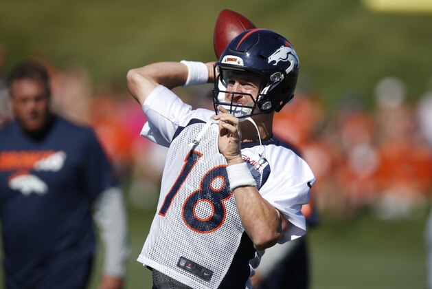 Denver Broncos quarterback Peyton Manning warms up at the team's NFL football training camp Saturday, Aug. 1, 2015, in Englewood, Colo. (AP Photo/David Zalubowski)
