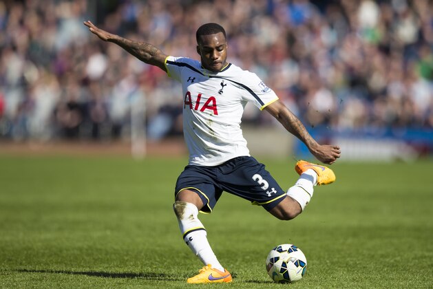 Tottenham's Danny Rose takes a shot during the English Premier League soccer match between Burnley and Tottenham at Turf Moor Stadium, Burnley, England, Sunday April 5, 2015. (AP Photo/Jon Super)