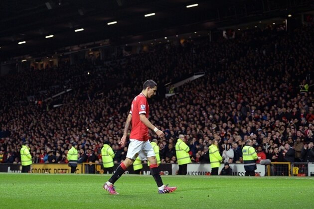 Manchester United's Argentinian midfielder Angel Di Maria is sent off by referee Michael Oliver after Di Maria is penalised for simulation and then sent off after tugging at the referee's back, during the FA Cup quarter-final football match between Manchester United and Arsenal at Old Trafford in Manchester, north west England, on March 9, 2015. AFP PHOTO / OLI SCARFF 

RESTRICTED TO EDITORIAL USE. No use with unauthorized audio, video, data, fixture lists, club/league logos or live services. Online in-match use limited to 45 images, no video emulation. No use in betting, games or single club/league/player publications.        (Photo credit should read OLI SCARFF/AFP/Getty Images)
