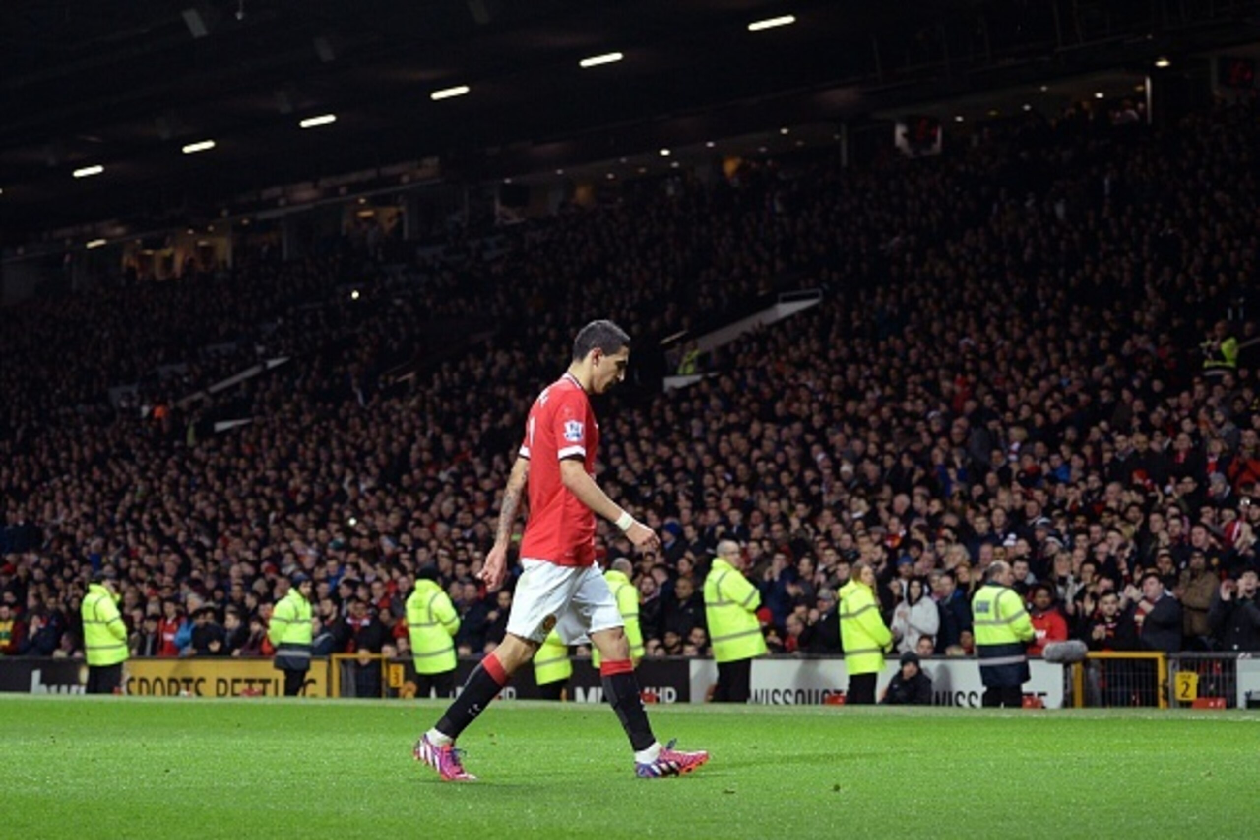 Manchester United's Argentinian midfielder Angel Di Maria is sent off by referee Michael Oliver after Di Maria is penalised for simulation and then sent off after tugging at the referee's back, during the FA Cup quarter-final football match between Manchester United and Arsenal at Old Trafford in Manchester, north west England, on March 9, 2015. AFP PHOTO / OLI SCARFF 

RESTRICTED TO EDITORIAL USE. No use with unauthorized audio, video, data, fixture lists, club/league logos or live services. Online in-match use limited to 45 images, no video emulation. No use in betting, games or single club/league/player publications.        (Photo credit should read OLI SCARFF/AFP/Getty Images)