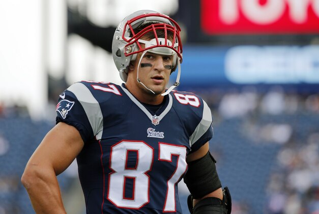 New England Patriots tight end Rob Gronkowski pauses during warm-up's before an NFL football game against the Oakland Raiders Sunday, Sept. 21, 2014, in Foxborough, Mass. (AP Photo/Elise Amendola)