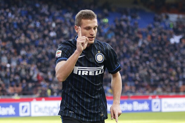 Inter Milan's Nemanja Vidic celebrates after scoring during the Serie A soccer match between Inter Milan and Genoa at the San Siro stadium in Milan, Italy, Sunday, Jan. 11, 2015. (AP Photo/Antonio Calanni)