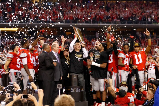 ARLINGTON, TX - JANUARY 12:  Head Coach Urban Meyer of the Ohio State Buckeyes hoist the trophy after defeating the Oregon Ducks 42 to 20 in the College Football Playoff National Championship Game at AT&T Stadium on January 12, 2015 in Arlington, Texas.  (Photo by Christian Petersen/Getty Images)