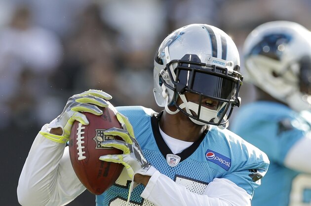 Carolina Panthers' Chris Houston (27) catches a pass during the NFL football team's training camp in Spartanburg, S.C., Friday, July 31, 2015. (AP Photo/Chuck Burton)