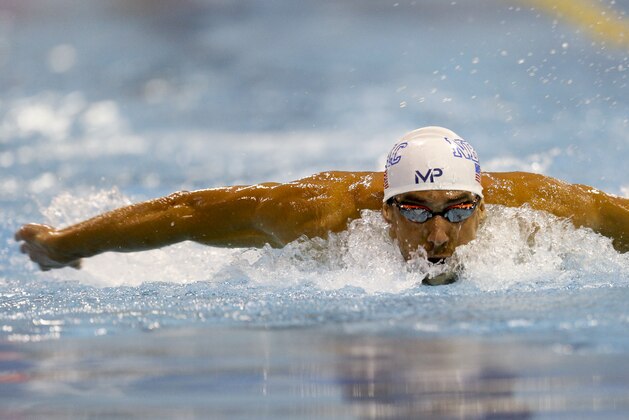 Michael Phelps swims the butterfly in the 200 meter individual medley preliminary race, qualifying seventh with a time of 2:03.06 at the Arena Pro Swim Series meet in Charlotte, N.C, Sunday, May 17, 2015. (AP Photo/Nell Redmond)
