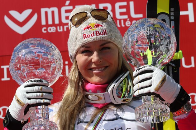 Lindsey Vonn, of the United States, holds the alpine ski, women's World Cup super-G and downhill's disciplines trophies as she celebrates on the podium, at the World Cup finals in Meribel, France, Thursday, March 19, 2015. (AP Photo/Armando Trovati) Lindsey Vonn, of the United States, holds the alpine ski, women's World Cup super-G and downhill's disciplines trophies as she celebrates on the podium, at the World Cup finals in Meribel, France, Thursday, March 19, 2015. (AP Photo/Armando Trovati)