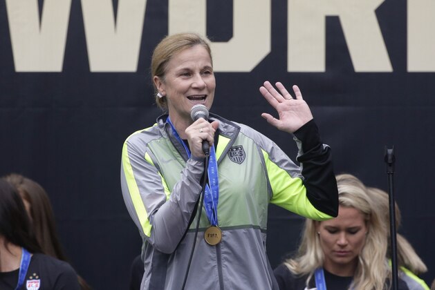U.S. women's soccer team coach Jill Ellis, center, speaks as she celebrates the team's World Cup championship during a public celebration, Tuesday, July 7, 2015, in Los Angeles. This was the first U.S. stop for the team since beating Japan in the Women's World Cup final Sunday in Canada. (AP Photo/Jae C. Hong)