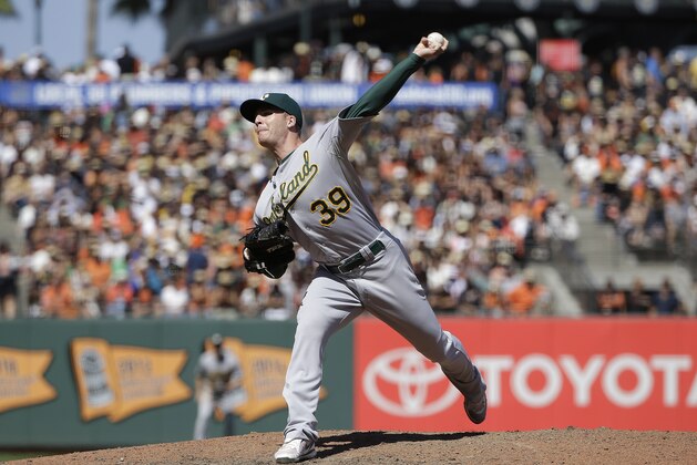 Oakland Athletics pitcher Eric O'Flaherty throws against the San Francisco Giants during a baseball game in San Francisco, Sunday, July 26, 2015. (AP Photo/Jeff Chiu)