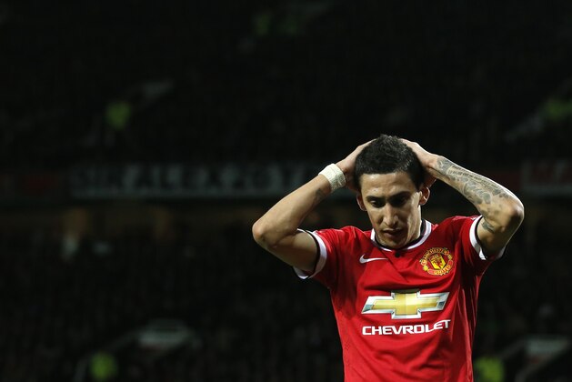 Manchester United’s Angel Di Maria holds his hands to his head after missing a chance to score a goal during the English FA Cup quarterfinal soccer match between Manchester United and Arsenal at Old Trafford Stadium, Manchester, England, Monday March 9, 2015. (AP Photo/Jon Super)