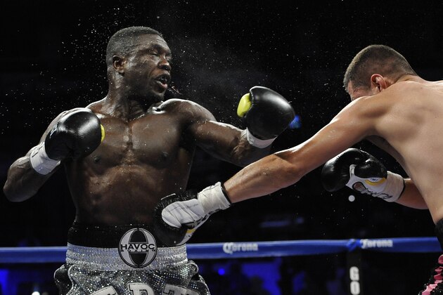 Andre Berto, left, and Jesus Soto Karass, of Mexico, exchange punches during a welterweight title boxing match, Saturday, July 27, 2013, in San Antonio. Soto Karass won by TKO in the 12th round. (AP Photo/Darren Abate)