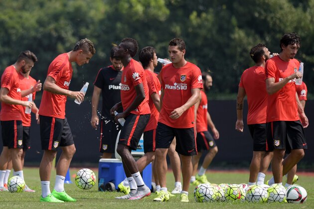 Atletico Madrid's new football signing Montenegrin Stefan Savic  (far R) attends a training session one day before the friendly football match between SIPG Shanghai and Atletico Madrid in Shanghai on August 3, 2015.    AFP PHOTO / JOHANNES EISELE        (Photo credit should read JOHANNES EISELE/AFP/Getty Images)