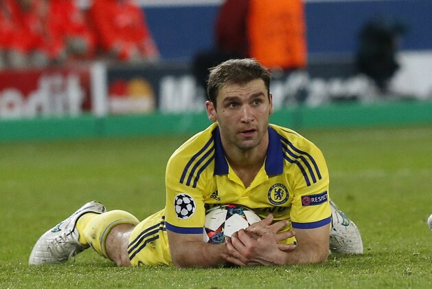 Chelsea's Branislav Ivanovic keeps the ball after being fouled during the Champions League round of 16 first leg soccer match between Paris Saint Germain and Chelsea at the Parc des Princes stadium in Paris, France, Tuesday, Feb. 17, 2015. (AP Photo/Michel Euler)