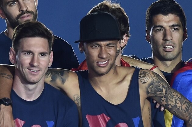 (FromL) Barcelona players, German goalkeeper Marc-Andre ter Stegen, French defender Jeremy Mathieu, goalkeeper Jordi Masip, forward Sandro Ramirez defender Gerard Pique, Argentinian forward Lionel Messi, Brazilian forward Neymar da Silva Santos Junior, Uruguayan forward Luis Suarez,  forward Munir El Haddadi and midfielder Andres Iniesta  as they take part in the celebrations held for their victory over Juventus, one day after the UEFA Champions League final football, at the Camp Nou stadium in Barcelona on June 7, 2015. Luis Suarez and Neymar scored second-half goals to give Barcelona a 3-1 Champions League final victory over Juventus on June 6, 2015 as the Spaniards became the first team to twice win the European treble.   AFP PHOTO/ JOSEP LAGO        (Photo credit should read JOSEP LAGO/AFP/Getty Images)