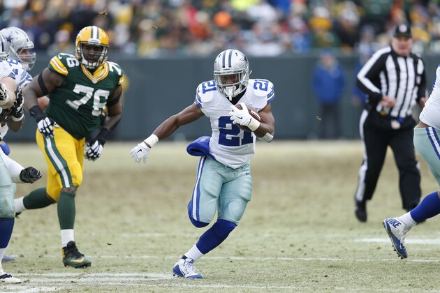 GREEN BAY, WI - JANUARY 11: Joseph Randle #21 of the Dallas Cowboys runs with the ball against the Green Bay Packers during the NFC Divisional Playoff game at Lambeau Field on January 11, 2015 in Green Bay, Wisconsin. The Packers defeated the Cowboys 26-21. (Photo by Joe Robbins/Getty Images)
