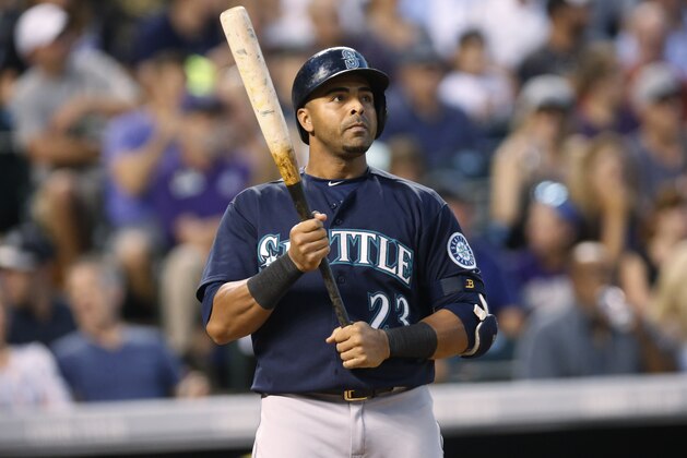 Seattle Mariners right fielder Nelson Cruz (23) steps to plate against the Colorado Rockies in the fifth inning of an inter league baseball game Tuesday, Aug. 4, 2015, in Denver. (AP Photo/David Zalubowski)
