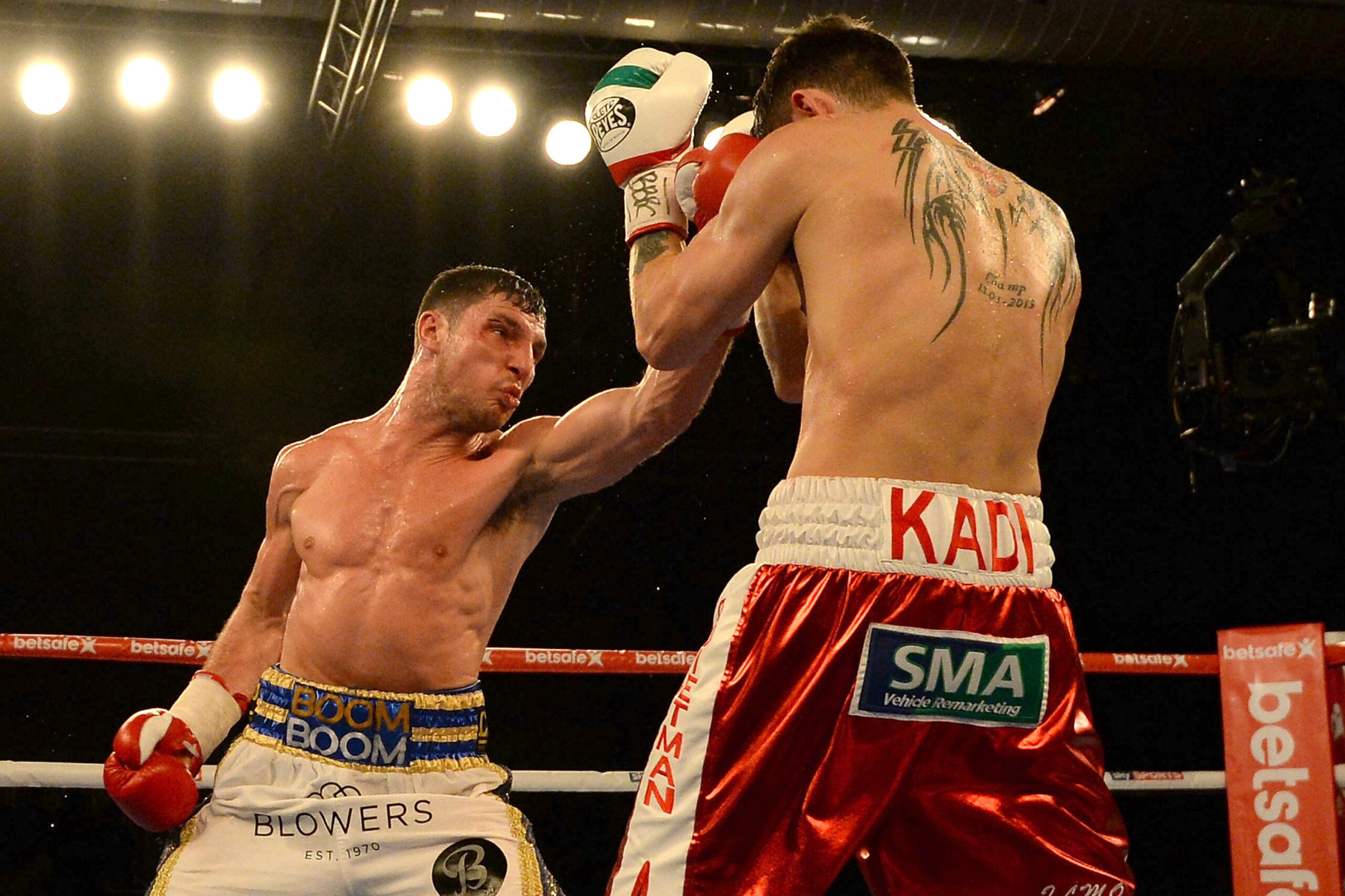 HULL, ENGLAND - MARCH 07:  Tommy Coyle (L) in action against Martin Gethin during their Lightweight contest at The Hull Arena on March 7, 2015 in Hull, England.  (Photo by Nigel Roddis/Getty Images)