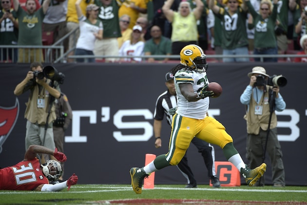 Green Bay Packers running back Eddie Lacy (27) rushes for a touchdown past Tampa Bay Buccaneers strong safety Bradley McDougald (30) during the first half of an NFL football game in Tampa, Fla., Sunday, Dec. 21, 2014.(AP Photo/Phelan M. Ebenhack)