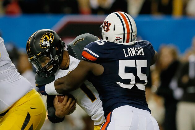 ATLANTA, GA - DECEMBER 07:  Carl Lawson #55 of the Auburn Tigers tackles quarterback James Franklin #1 of the Missouri Tigers in the second quarter during the SEC Championship Game at Georgia Dome on December 7, 2013 in Atlanta, Georgia.  (Photo by Kevin C. Cox/Getty Images)