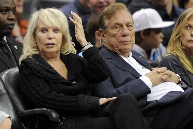 FILE - In this Nov. 12, 2010, file photo, Shelly Sterling, left, sits with her husband, Los Angeles Clippers owner Donald Sterling, during the Clippers' NBA basketball game against the Detroit Pistons in Los Angeles. The former team owner has filed for divorce from Shelly Sterling, his attorney Bobby Samini said Wednesday, Aug. 5, 2015. (AP Photo/Mark J. Terrill, File)