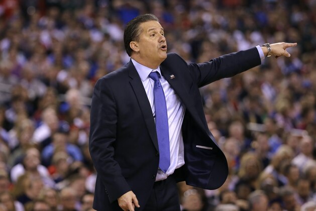 Kentucky head coach John Calipari directs his team during the first half of the NCAA Final Four tournament college basketball semifinal game against Wisconsin Saturday, April 4, 2015, in Indianapolis. (AP Photo/David J. Phillip)