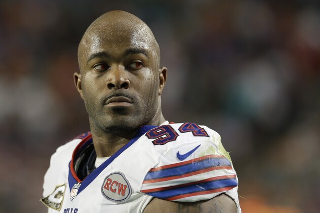 Buffalo Bills defensive end Mario Williams looks up as he wears red contact lenses during the second half of an NFL football game against the Miami Dolphins, Thursday, Nov. 13, 2014 in Miami Gardens, Fla. (AP Photo/Alan Diaz)