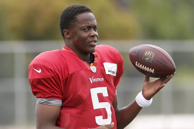 Minnesota Vikings quarterback Teddy Bridgewater warms up before practice at an NFL football training camp on the campus of Minnesota State University Tuesday, July 28, 2015, in Mankato, Minn. (AP Photo/Charles Rex Arbogast)