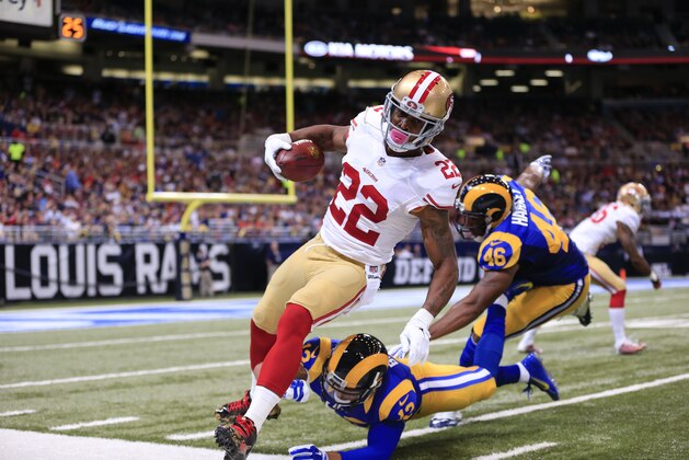 San Francisco 49ers kick returner Chris Cook (22) is run out of bounds by St. Louis Rams wide receiver Stedman Bailey (12) in the first quarter of an NFL football game Monday, Oct. 13, 2014, in St Louis. (AP Photo/Billy Hurst)