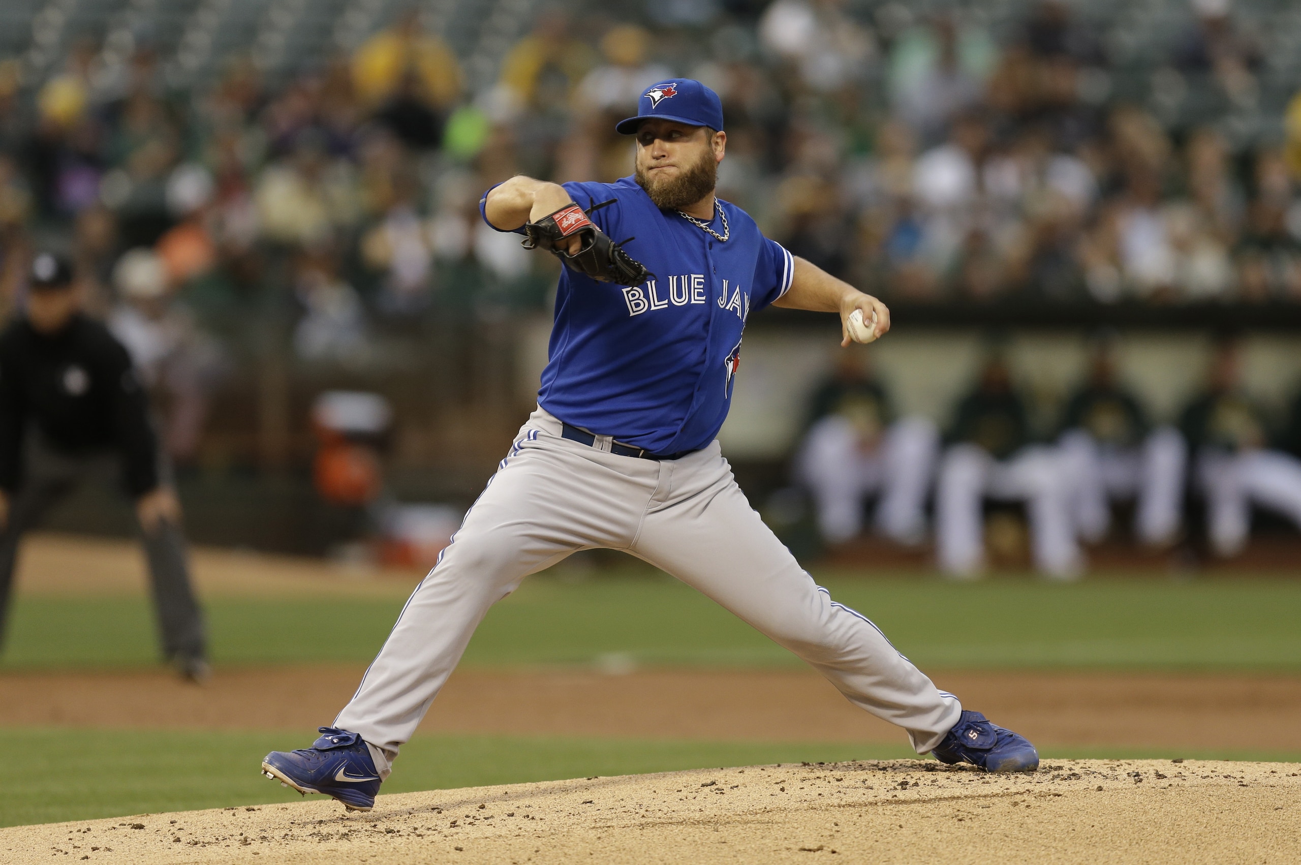 Toronto Blue Jays pitcher Mark Buehrle works against the Oakland Athletics in the first inning of a baseball game Tuesday, July 21, 2015, in Oakland, Calif. (AP Photo/Ben Margot)