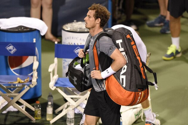 Andy Murray, of Britain, leaves the court after he lost to Teymuraz Gabashvili, of Russia, 6-4, 4-6, 7-6 (4) at the Citi Open tennis tournament, Wednesday, Aug. 5, 2015, in Washington. (AP Photo/Nick Wass)