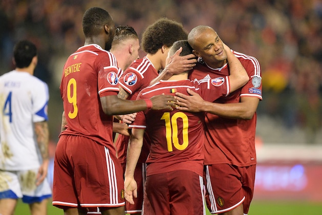 Belgium's Eden Hazard, center, celebrates with teammate Vincent Kompany, right, after scoring during the Euro 2016 Group B qualifying soccer match between Belgium and Cyprus, at the King Baudouin stadium, in Brussels on Saturday, March 28, 2015. (AP Photo/Laurent Dubrule)