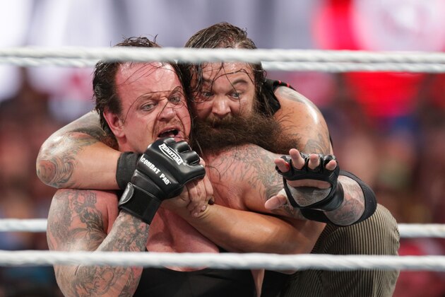 Bray Wyatt keeps his opponent The Undertaker in a hold at Wrestlemania XXXI, on Sunday, March 29, 2015 in Santa Clara, CA. 2015 marks the first year Wrestlemania will be held in the San Francisco Bay Area, being made available to viewers in 177 countries via the WWE Network. (Don Feria/AP Images for WWE)
