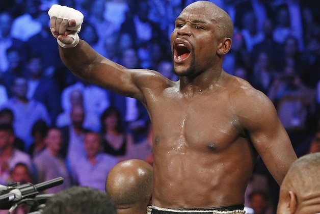 FILE - In this May 2, 2015, file photo, boxer Floyd Mayweather Jr., celebrates his unanimous decision victory over Manny Pacquiao, from the Philippines, after their welterweight title fight in Las Vegas. Mayweather Jr. will return to the ring for the first time since boxing's richest fight ever, facing Andre Berto on Sept. 12 in Las Vegas. (AP Photo/John Locher, File)