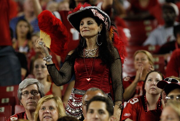 Aug 29, 2013; Tampa, FL, USA; Tampa Bay Buccaneers fan in the stands watches the game against the Washington Redskins during the first half at Raymond James Stadium. Mandatory Credit: Kim Klement-USA TODAY Sports