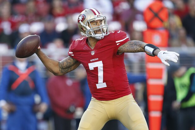 San Francisco 49ers quarterback Colin Kaepernick (7) passes against the Arizona Cardinals during the second quarter of an NFL football game in Santa Clara, Calif., Sunday, Dec. 28, 2014. (AP Photo/Tony Avelar)