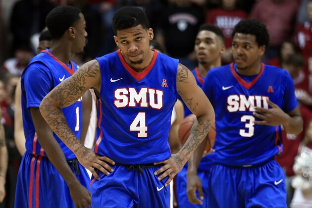 FILE - In this Nov 20, 2014, file photo, SMU's Keith Frazier (4) looks up at the scoreboard late in the second half of an NCAA college basketball game against Indiana in Bloomington, Ind. SMU acknowledged Friday, Jan. 16, 2015, that it was facing an NCAA investigation after announcing earlier in the day an appeal of an academic suspension that would sideline Frazier for the rest of the season. The investigation was announced three days after the school said assistant coach Ulric Maligi was taking an indefinite leave of absence for personal reasons. Maligi recruited Frazier out of Kimball High School in Dallas. (AP Photo/Darron Cummings, File)