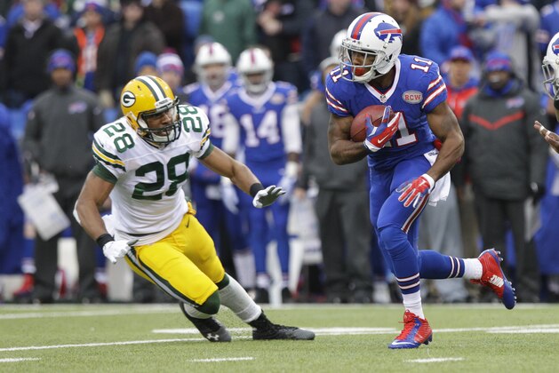 Buffalo Bills running back Marcus Thigpen (11) runs past Green Bay Packers' Sean Richardson (28) for a touchdown during the first half of an NFL football game Sunday, Dec. 14, 2014, in Orchard Park, N.Y. (AP Photo/Bill Wippert)
