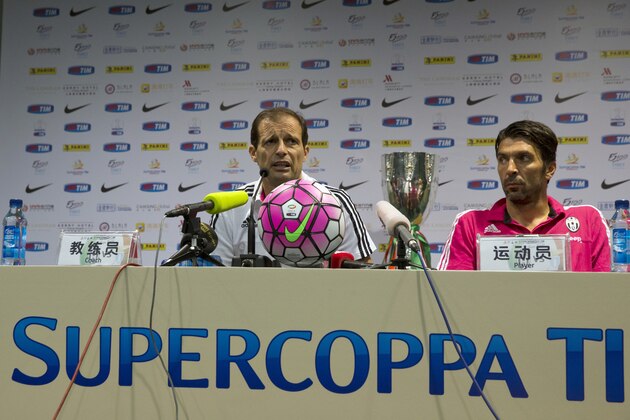 Juventus manager Massimiliano Allegri, left, and Juventus captain Gianluigi Buffon attend a press conference ahead of the 2015 TIM Italian Supercup against Lazio at the Shanghai Stadium in Shanghai Thursday, Aug. 6, 2015. (AP Photo/Ng Han Guan)