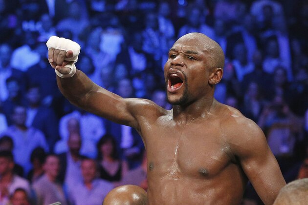 FILE - In this May 2, 2015, file photo, boxer Floyd Mayweather Jr., celebrates his unanimous decision victory over Manny Pacquiao, from the Philippines, after their welterweight title fight in Las Vegas. Mayweather Jr. will return to the ring for the first time since boxing's richest fight ever, facing Andre Berto on Sept. 12 in Las Vegas. (AP Photo/John Locher, File)