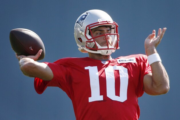 New England Patriots quarterback Jimmy Garoppolo passes during an NFL football training camp in Foxborough, Mass., Saturday, Aug. 1, 2015. (AP Photo/Michael Dwyer)