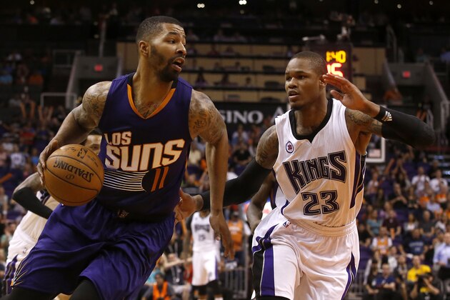 Phoenix Suns forward Markieff Morris (11) drives on Sacramento Kings guard Ben McLemore (23) in the third quarter during an NBA basketball game, Wednesday, March 25, 2015, in Phoenix. (AP Photo/Rick Scuteri)