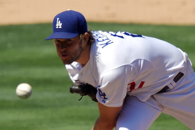 Los Angeles Dodgers starting pitcher Clayton Kershaw throws to the plate during the seventh inning of a baseball game against the Los Angeles Angels, Saturday, Aug. 1, 2015, in Los Angeles. (AP Photo/Mark J. Terrill)
