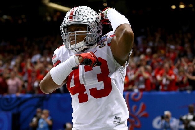 NEW ORLEANS, LA - JANUARY 01:  Darron Lee #43 celebrates teammate Steve Miller #88 of the Ohio State Buckeyes after scoring a 41 yard interception return from Blake Sims #6 of the Alabama Crimson Tide in the third quarter during the All State Sugar Bowl at the Mercedes-Benz Superdome on January 1, 2015 in New Orleans, Louisiana.  (Photo by Streeter Lecka/Getty Images)