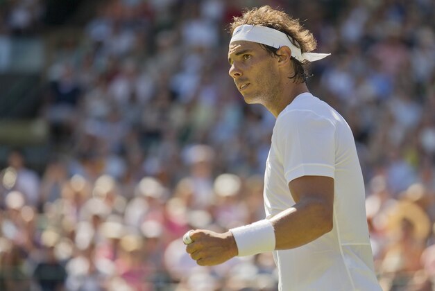 Jun 30, 2015; London, United Kingdom; Rafael Nadal (ESP) reacts during his match against Thomaz Bellucci (BRA) on day two of The Championships Wimbledon at the AELTC. Mandatory Credit: Susan Mullane-USA TODAY Sports