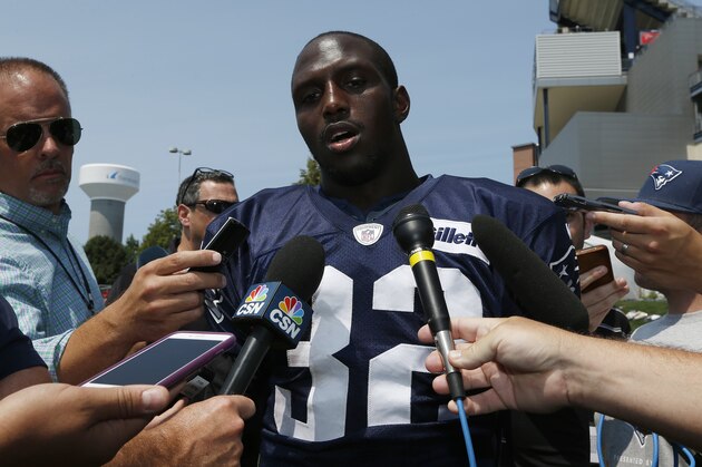 New England Patriots defensive back Devin McCourty talks with reporters during an NFL football training camp in Foxborough, Mass., Saturday, Aug. 1, 2015. (AP Photo/Michael Dwyer)