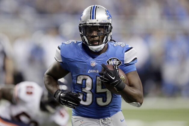 Detroit Lions running back Joique Bell rushes for a 1-yard touchdown during the second half of an NFL football game against the Chicago Bears in Detroit, Thursday, Nov. 27, 2014. (AP Photo/Duane Burleson)