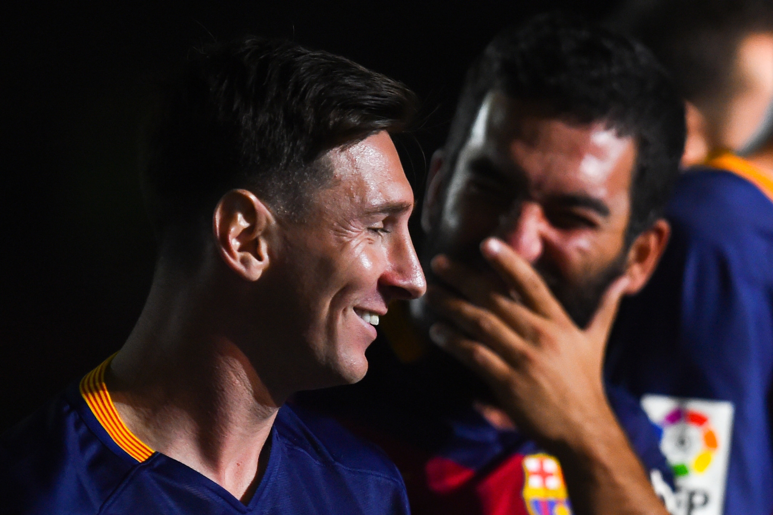 BARCELONA, SPAIN - AUGUST 05:  Lionel Messi (L) and Arda Turan of FC Barcelona  share a joke during the team official presentation ahead of the Joan Gamper trophy match at Camp Nou on August 5, 2015 in Barcelona, Spain.  (Photo by David Ramos/Getty Images)