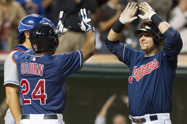 CLEVELAND, OH - SEPTEMBER 6: Michael Bourn #24 of the Cleveland Indians celebrates with Nick Swisher #33 after Swisher hit a grand slam during the eighth inning against the New York Mets at Progressive Field on September 6, 2013 in Cleveland, Ohio. (Photo by Jason Miller/Getty Images)